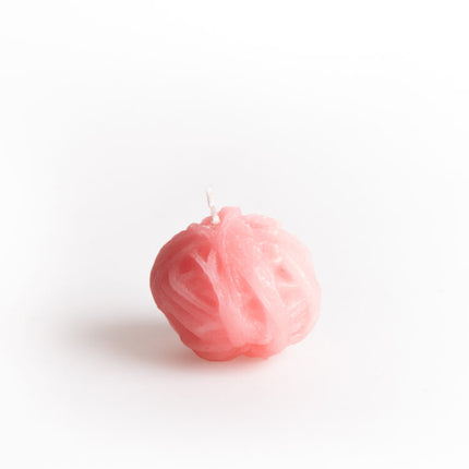 pink ball of twine candle