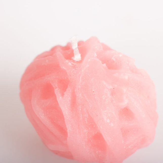 pink ball of twine candle