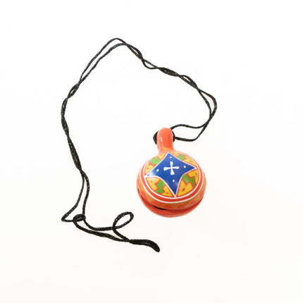 red jingle bell on cord