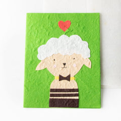 cream sheep on green card