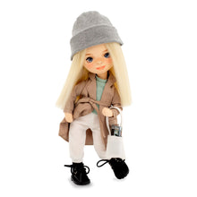 sweet sisters mia in a beige trench coat